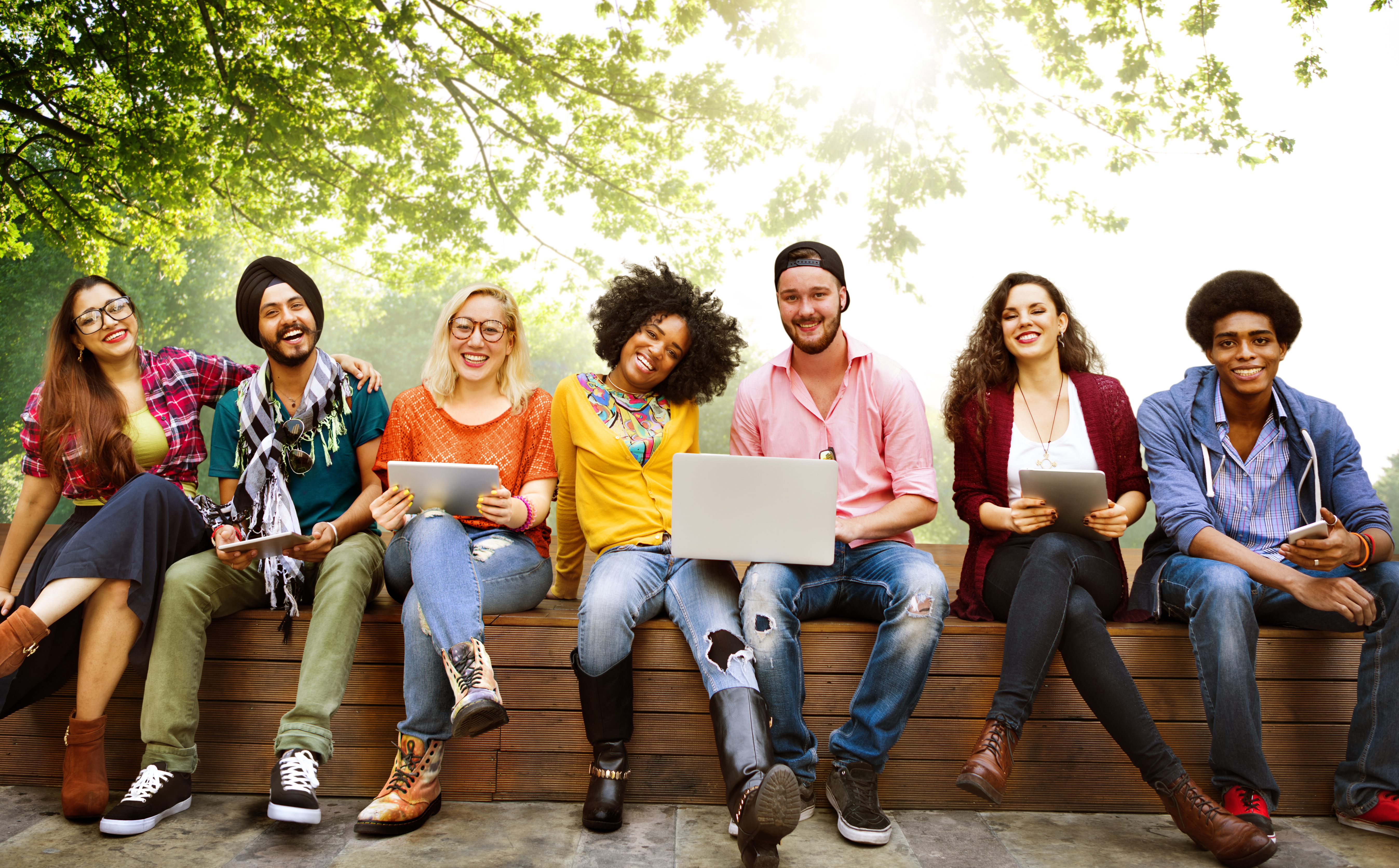 Multi-ethnic group of college students sitting together   