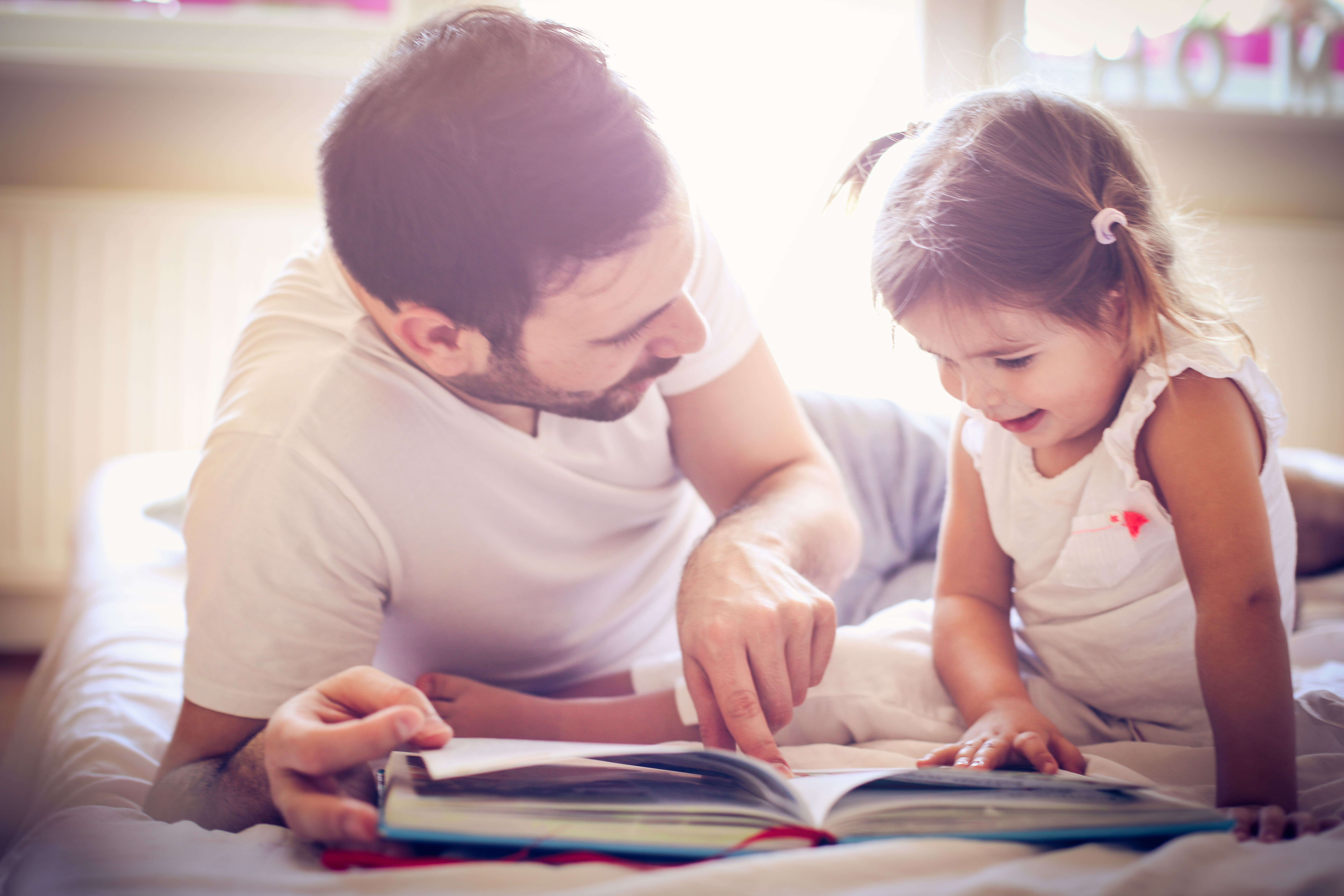 Parent and child reading a book