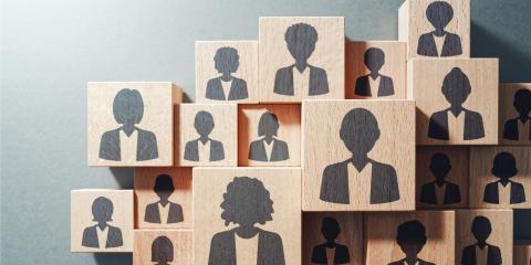 Image of wooden blocks with illustrations of people on them