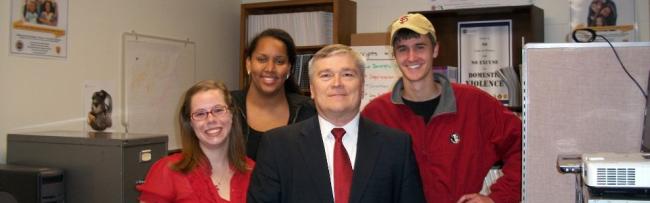 FSU President Eric Barron meets with students at the Institute for Family Violence Studies.