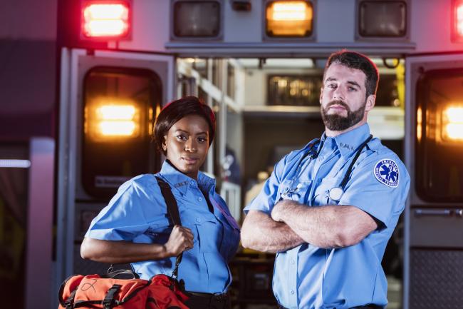 Two EMS professionals posing for picture