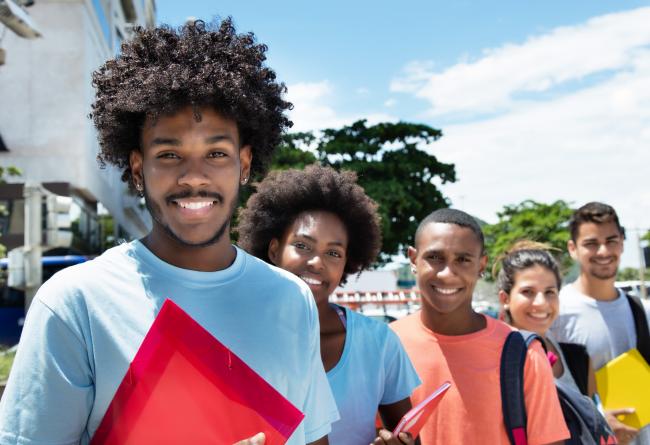Group of multi-racial students smiling at camera